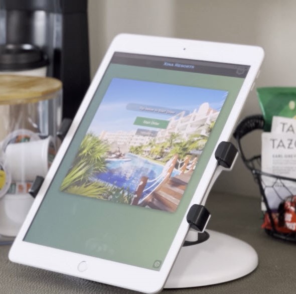 Xina.ai software on a tablet in a restaurant.
